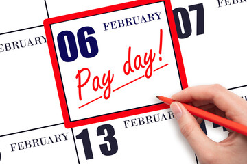 Hand writing text PAY DATE on calendar date February 6 and underline it. Payment due date
