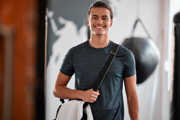 Fototapeta na wymiar Portrait, fitness and smile of man in gym ready to start workout, training or exercise. Sports, wellness and happy, proud and confident male athlete from Brazil preparing for exercising for health.