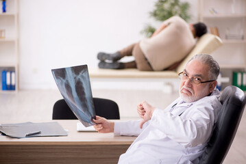 Young male patient visiting old male doctor radiologist