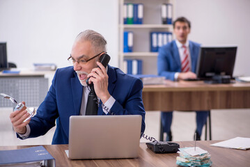 Two male colleagues in employee of the month concept