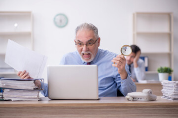 Two male colleagues working in the office