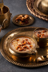 Famous Indian dessert kheer or semiya payasam topped with dry fruits and nuts