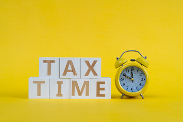Tax time blocks with alarm clock