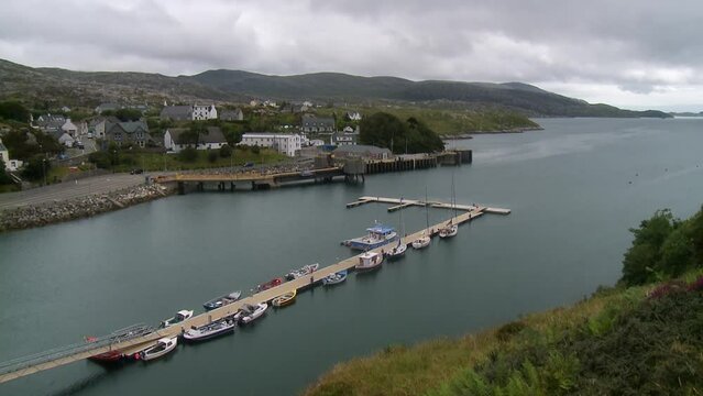 A shot of the village of Tarbert with the pontoon dock in the foreground. Filmed on the Isle of Harris, part of the Outer Hebrides of Scotland.