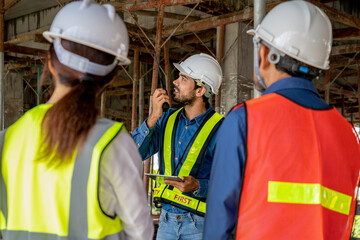 civil engineer inspects material of infrastructure construction to prevent environmental impact with team architect foreman for sustainable green building high upstairs level site preparation
