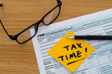 Tax time sticker with 1040 tax form