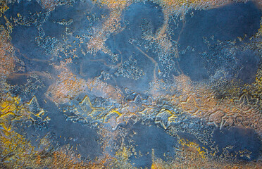 Blue background of decorative plaster with abstract spots. Unusual texture of this wall with beautiful patterns, creative surface background. Finishing coating for building cladding.