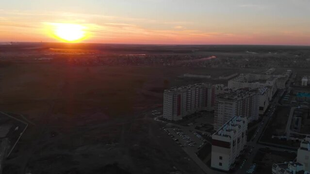 Reveal shot over the Omsk residental district sunset time , Amur