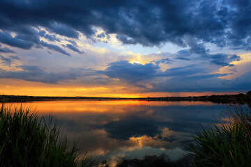 A Picturesque View of the Sunset over the Calm Waters