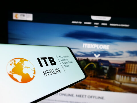Stuttgart, Germany - 03-19-2023: Smartphone with logo of German tourism trade fair ITB Berlin on screen in front of website. Focus on center of phone display.