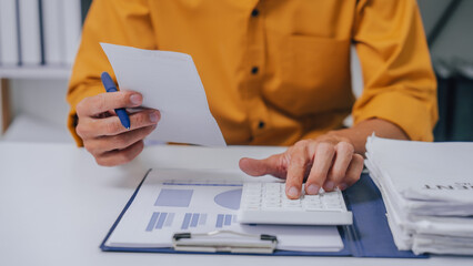Young Serious asia people bookkeeper doing bookkeeping entrepreneur small business owner accountant...