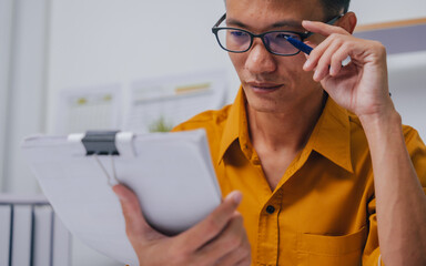Young Serious asia people bookkeeper doing bookkeeping entrepreneur small business owner accountant...