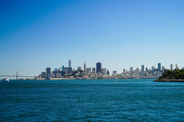 Skyline from San Francisco taken from the water on a sunny day with blue sky