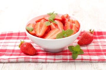 bowl of strawberries and mint leaf