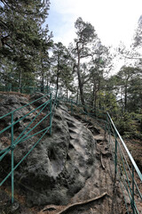 Metal railings in the rocky tourist path