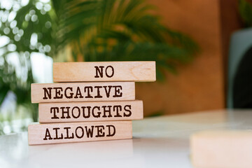 Wooden blocks with words 'No Negative Thoughts Allowed'.