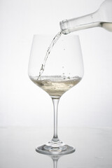GLASS OF WHITE WINE IN MOTION