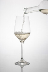 GLASS OF WHITE WINE IN MOTION