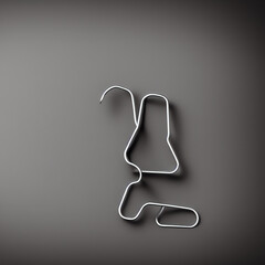 Bent Paper Clip On A Grey Table