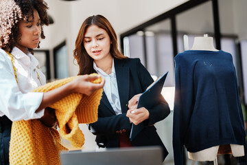Multi ethnic young teen african american and asian woman fashion designer stylish and friend working at fashion Business studio