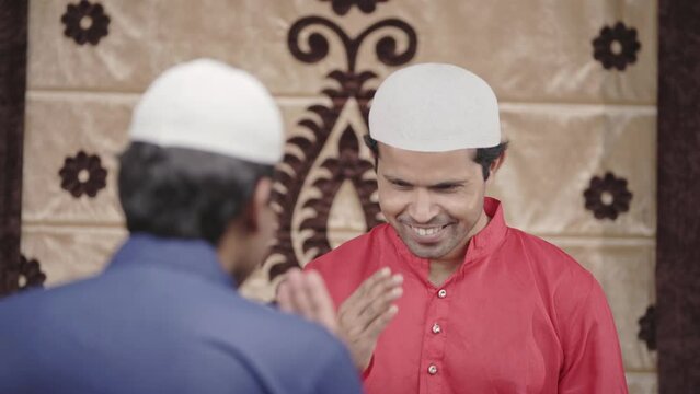 Muslim men greeting his friend by Adaab
