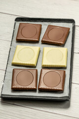 Butter biscuit cakes with white and brown milk chocolate
