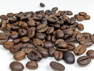 scattered coffee beans isolated on white