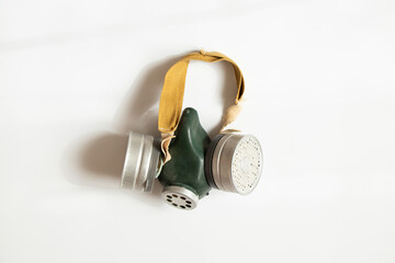 Civilian gas mask with two filters on a white background, an old Soviet filtering means of personal...