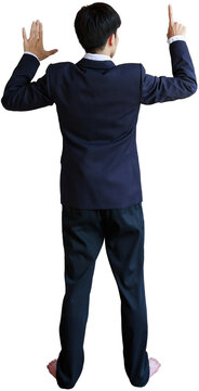 Rear view of young asian business man in formal suit touching virtual screen
