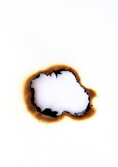 burned hole on a white paper background