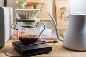 drip coffee processing on a black scale 