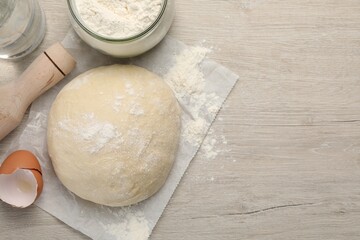 Cooking scones with soda water. Dough and ingredients on white wooden table, flat lay. Space for text