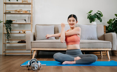 Asian Woman Doing Yoga and Watching Online Tutorials on Laptop, Training in Living Room