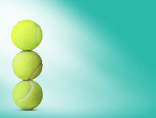 Stack of tennis balls on turquoise background. Space for text