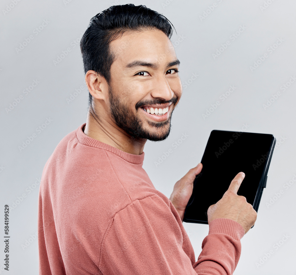 Sticker Portrait, smile and Asian man with tablet in studio isolated on a gray background. Face, technology and happy male model with digital touch screen for social media, web scrolling or internet browsing