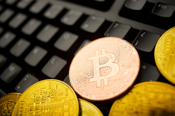 Bitcoin coins on a computer keyboard