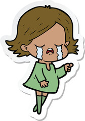 sticker of a cartoon girl crying