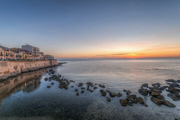 Syracuse Sicily. the sunrise of a new day on the beautiful seafront of Ortigia
