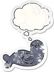 cartoon seal and thought bubble as a distressed worn sticker