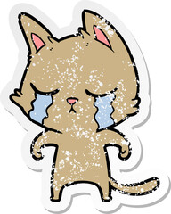 distressed sticker of a crying cartoon cat