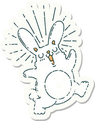 grunge sticker of tattoo style prancing rabbit