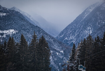 Cloudy day on famous Italian Alps Brenta Dolomites, snow on the slopes of the Alps Madonna di Campiglio, Pinzolo, Italy. Ski resorts in Italy. January 2023