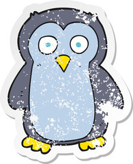 retro distressed sticker of a cartoon penguin