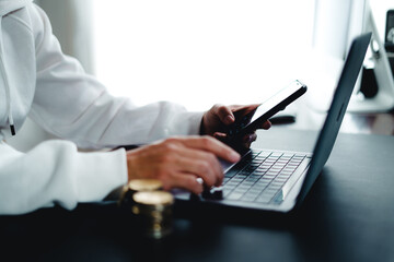 Bitcoin and laptop,Hand Using laptop in home