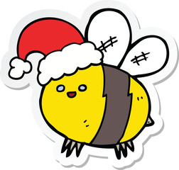 sticker of a cute cartoon bee wearing christmas hat