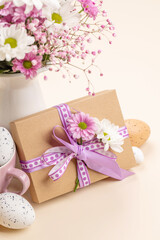 Fototapeta na wymiar Gift box, Easter eggs and flowers