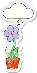 cute cartoon flower and thought bubble as a distressed worn sticker