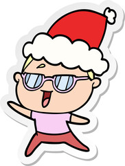 sticker cartoon of a happy woman wearing spectacles wearing santa hat