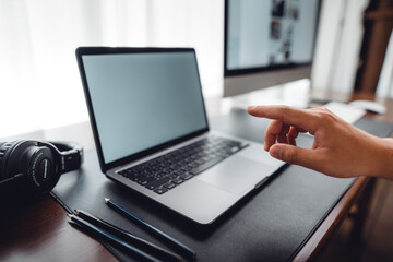 hands working on a laptop computer