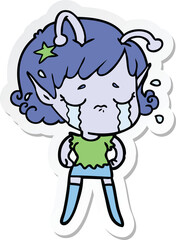 sticker of a cartoon crying alien girl
